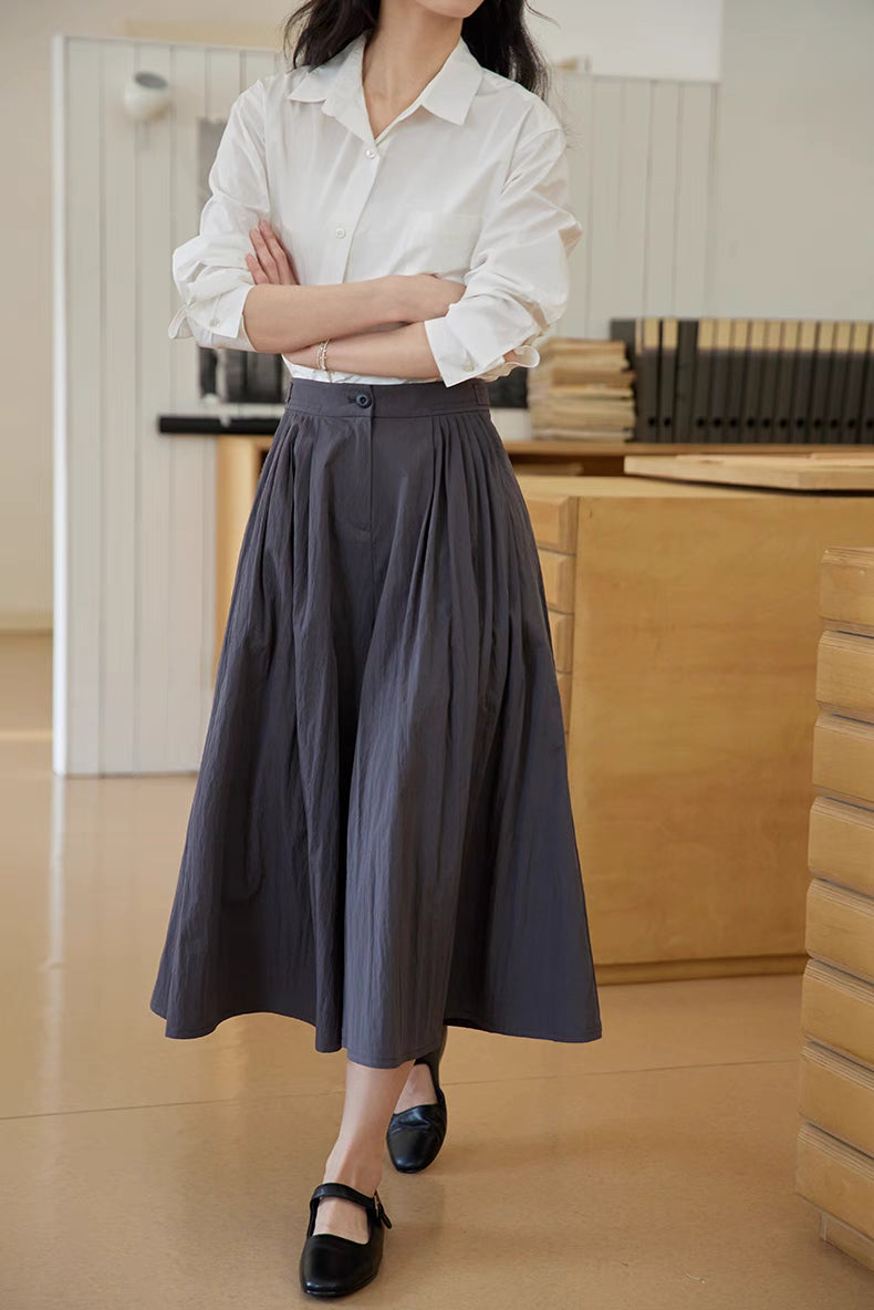 The Poised Pleated Midi Skirt